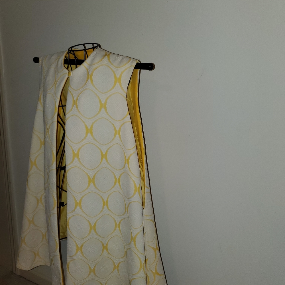 Vintage 60's, very attractive vest. 34" long from shoulder with a 26" flair.